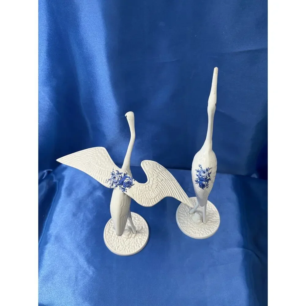 Pair of White Enamel Metal Cranes Accented with Blue Flower Design